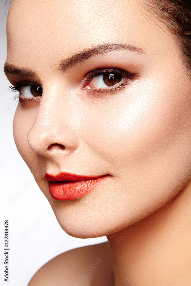 Beautiful model with fashion make-up. Close-up portrait sexy woman with glamour lip gloss makeup and black eyeliner make-up. Shot of celebrate visage, clean skin, lips with red lipstick, eyebrows Beautiful model with fashion make-up. Close-up portrait sexy woman with glamour lip gloss makeup and black eyeliner make-up. Shot of celebrate visage, clean skin, lips with red lipstick, eyebrows