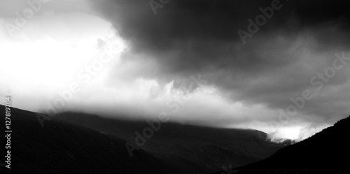 Black and white overcasted mountain landscape background