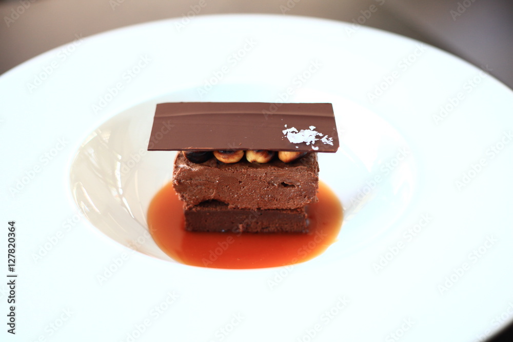 Chocolate tower with roasted hazenuts, dulce de leche and salt flakes Chocolate tower with roasted hazenuts, dulce de leche and salt flakes