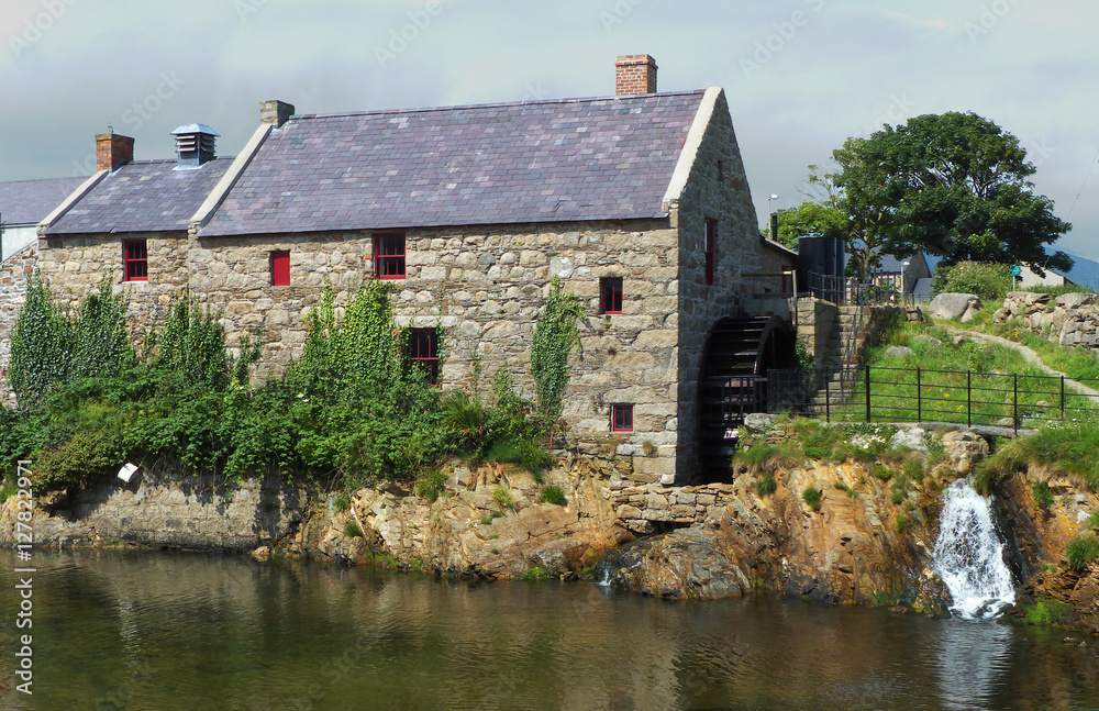 Historic stone built corn mill with water wheel and race in County Down, Northern Ireland