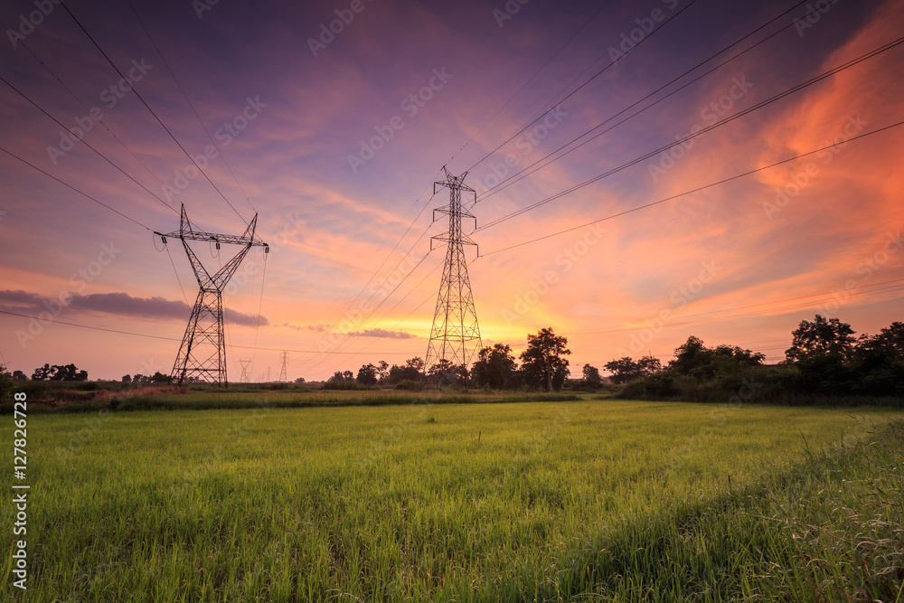 High voltage electric tower and beautiful sunrise