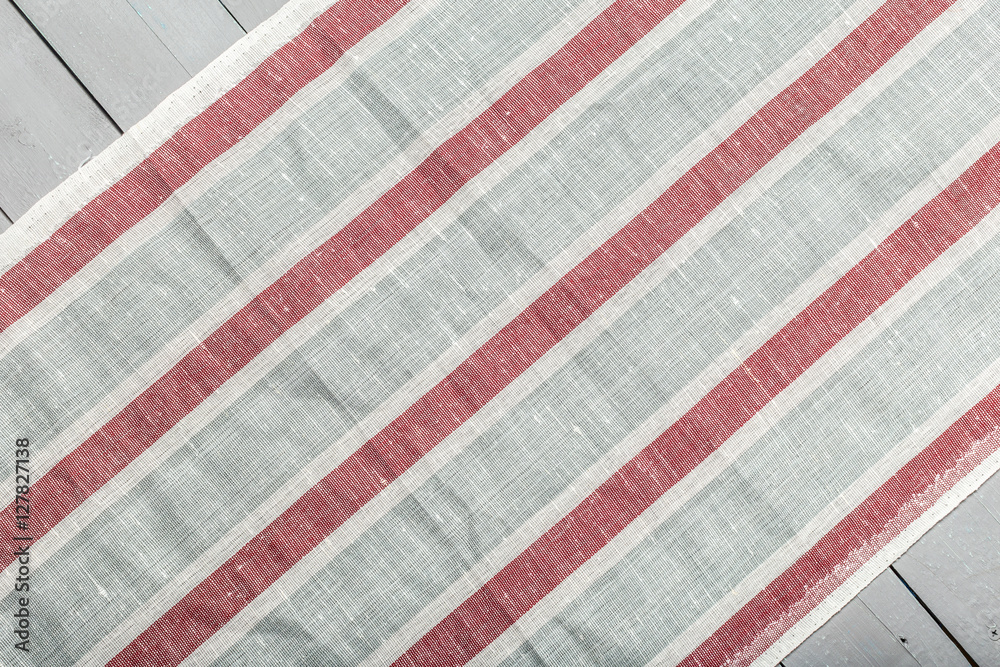 Fototapeta premium Tablecloth textile on wooden background
