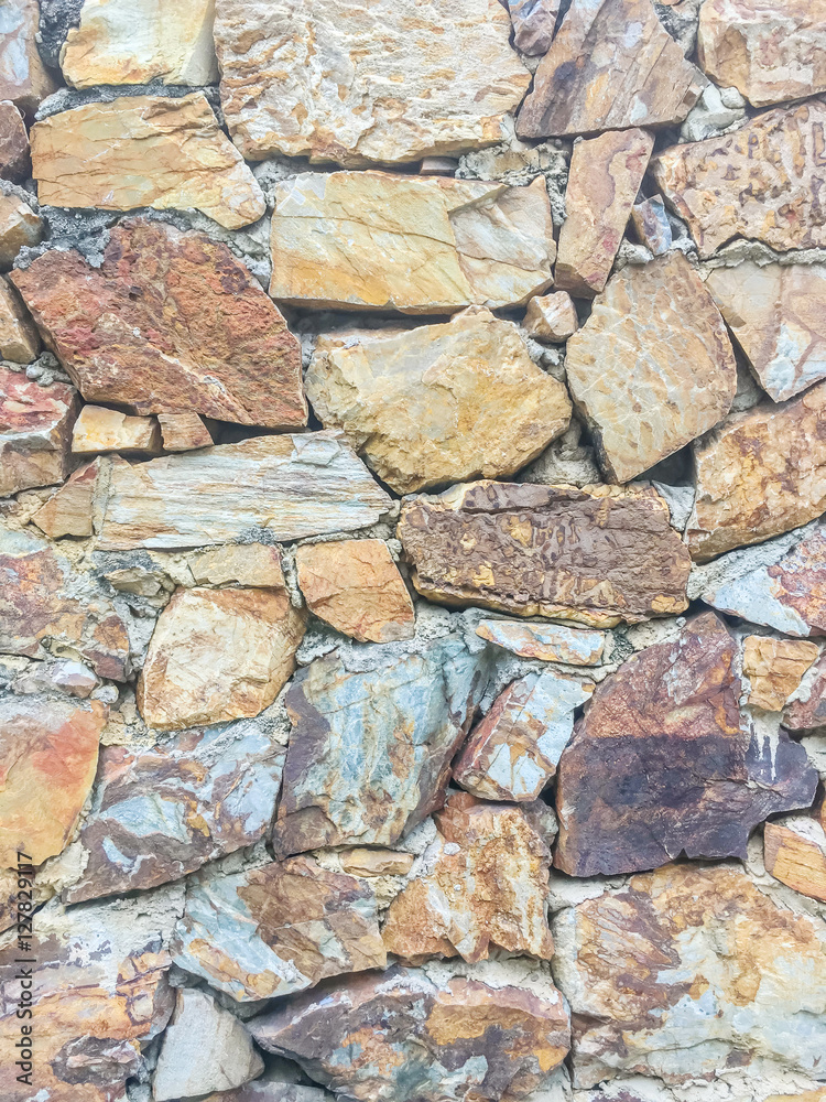 Closeup surface brick pattern at old stone brick wall textured background Closeup surface brick pattern at old stone brick wall textured background
