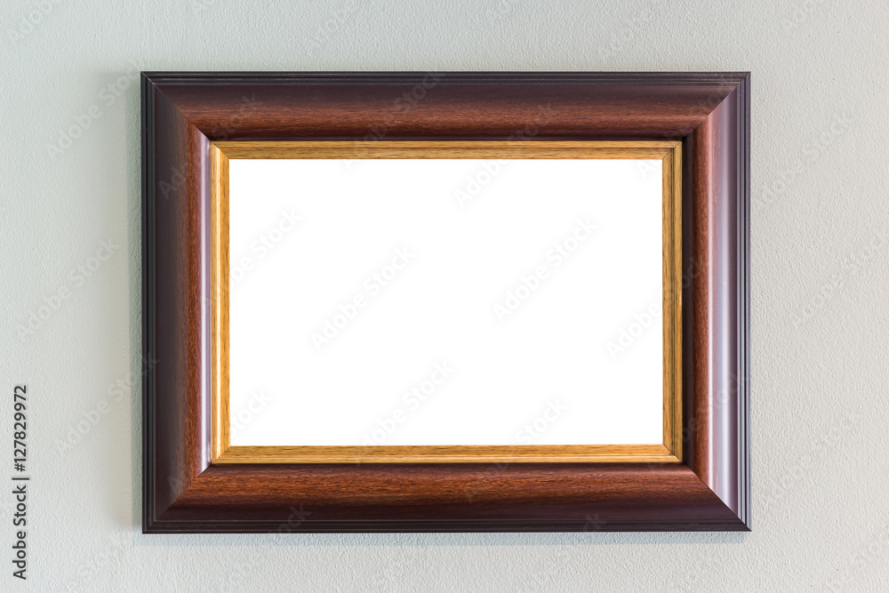 Wooden photo frame hanging on the wall. Interior decoration