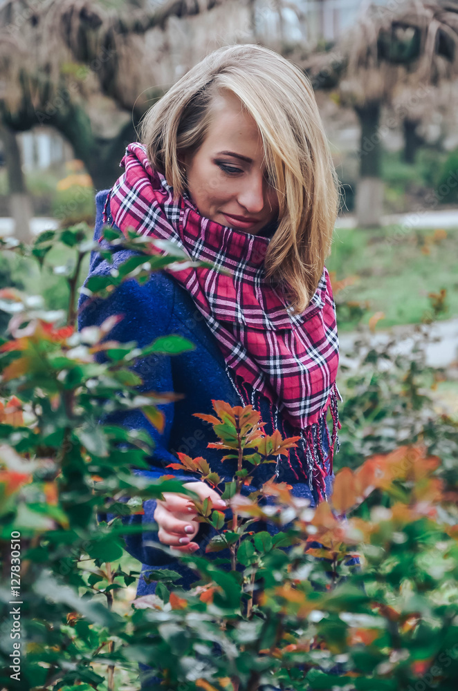 Young beautiful woman in autumn park. Closeup outdoors portrait of gorgeous young woman wearing autumn outfit. Young beautiful woman in autumn park. Closeup outdoors portrait of gorgeous young woman wearing autumn outfit.