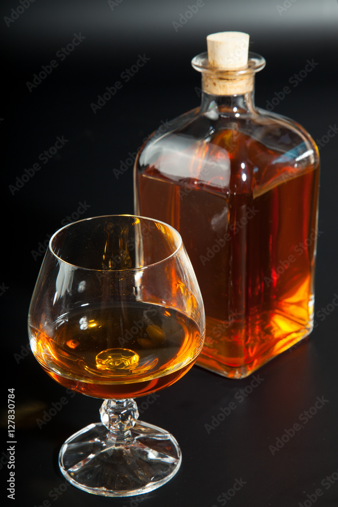Glass of brandy and a carafe Glass of brandy and a carafe
