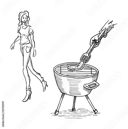 Vrouw kijkt naar steak op de barbecue photo