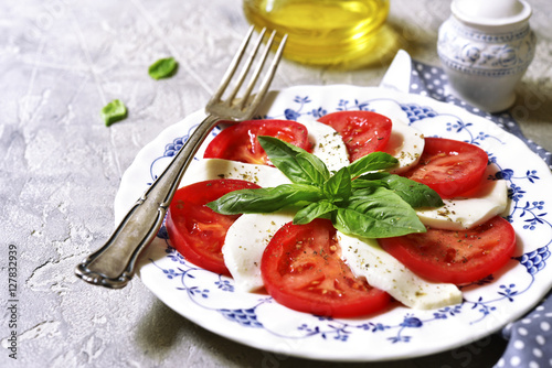 Traditional italian salad caprese on a vintage plate.