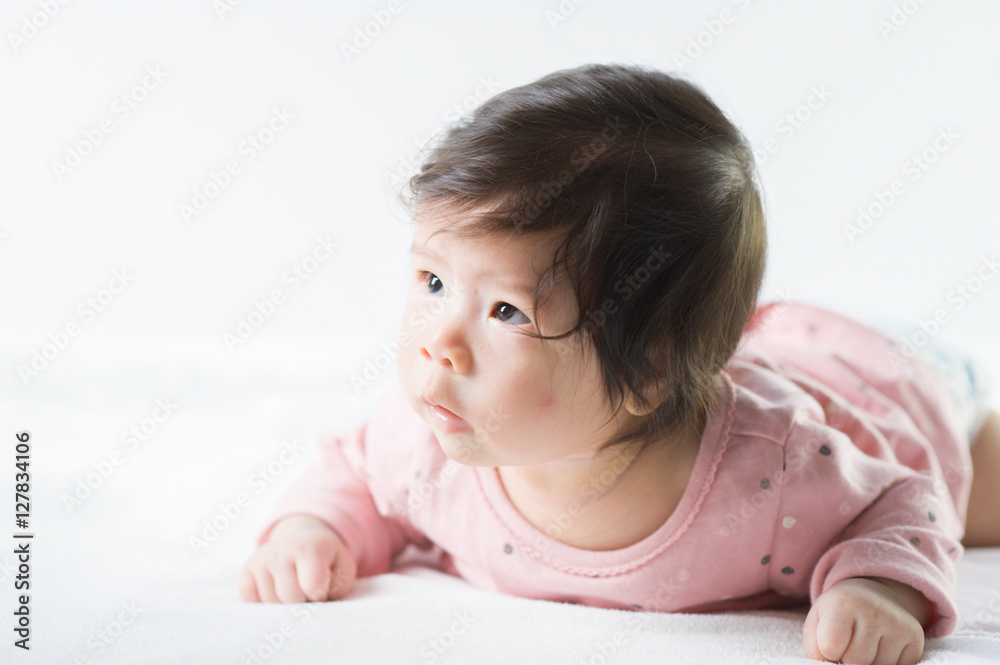 newborn baby girl in pink dress on white background newborn baby girl in pink dress on white background