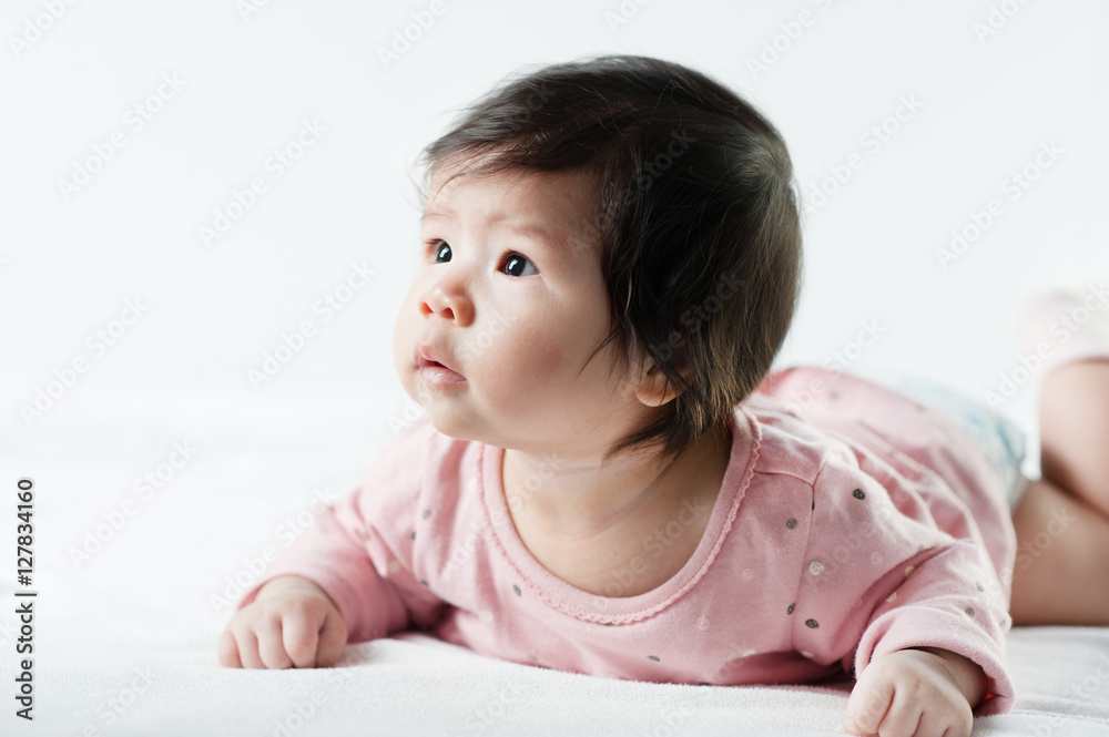 newborn baby girl in pink dress on white background newborn baby girl in pink dress on white background