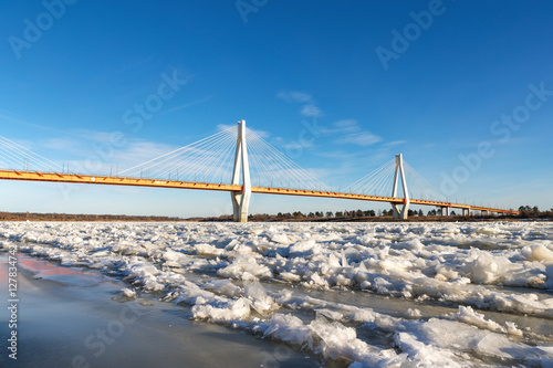 bridge in north of river covered with ice © JENOCHE