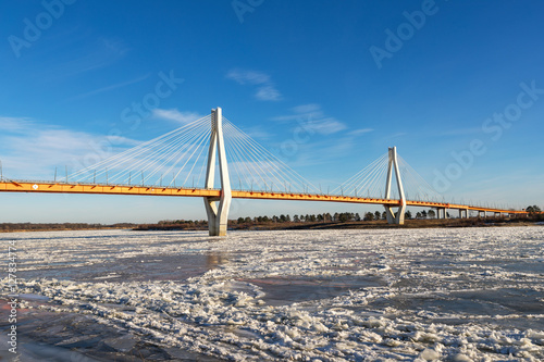 bridge in north of river covered with ice