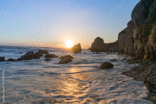 Last sunlight reflecting off the Pacific Ocean at El Matador State Beach Malibu California