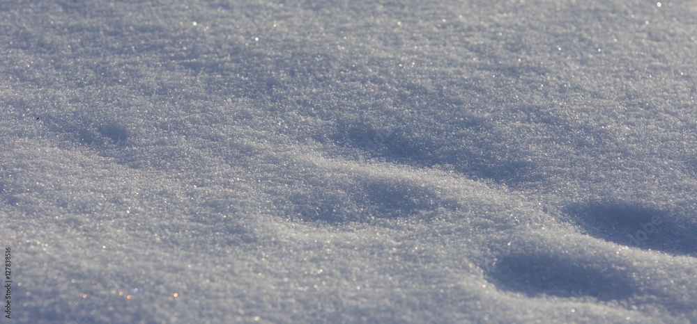 Beautiful isoalted picture of a sunny white snow with the footprints Beautiful isoalted picture of a sunny white snow with the footprints
