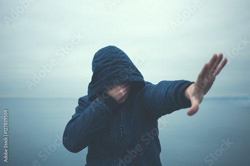 Canvas Print man full of shame hide himself crying