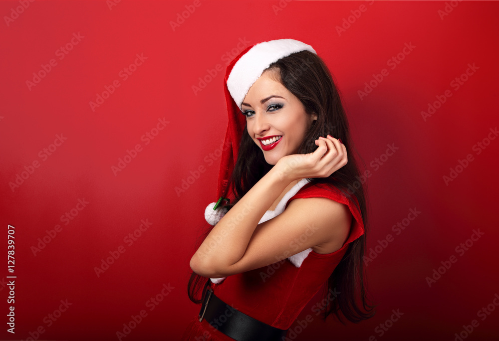 Laughing beautiful woman with toothy wide smile in santa claus c Laughing beautiful woman with toothy wide smile in santa claus c
