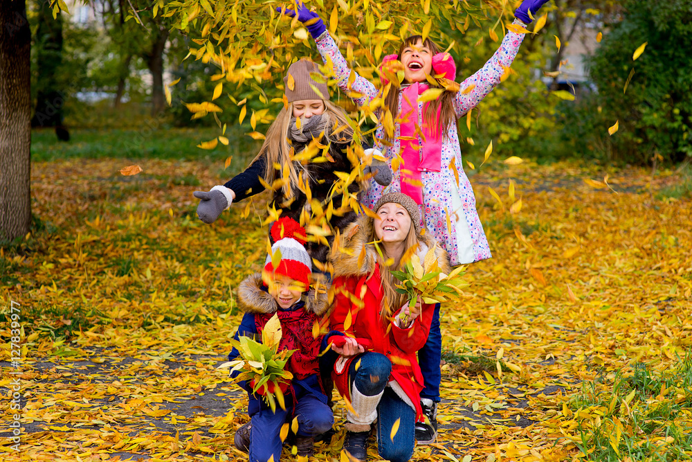group of girls in autumn park on the brench group of girls in autumn park on the brench