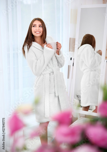 Beautiful girl in bathrobe ...