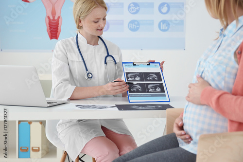 Pregnant woman with doctor ...