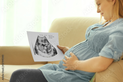 Pregnant woman with baby ul...