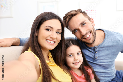 Happy family taking selfie ...