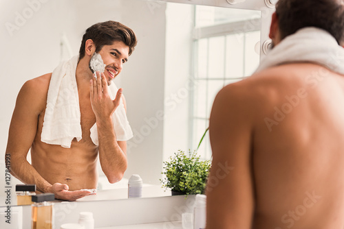 Happy guy is ready to shave photo