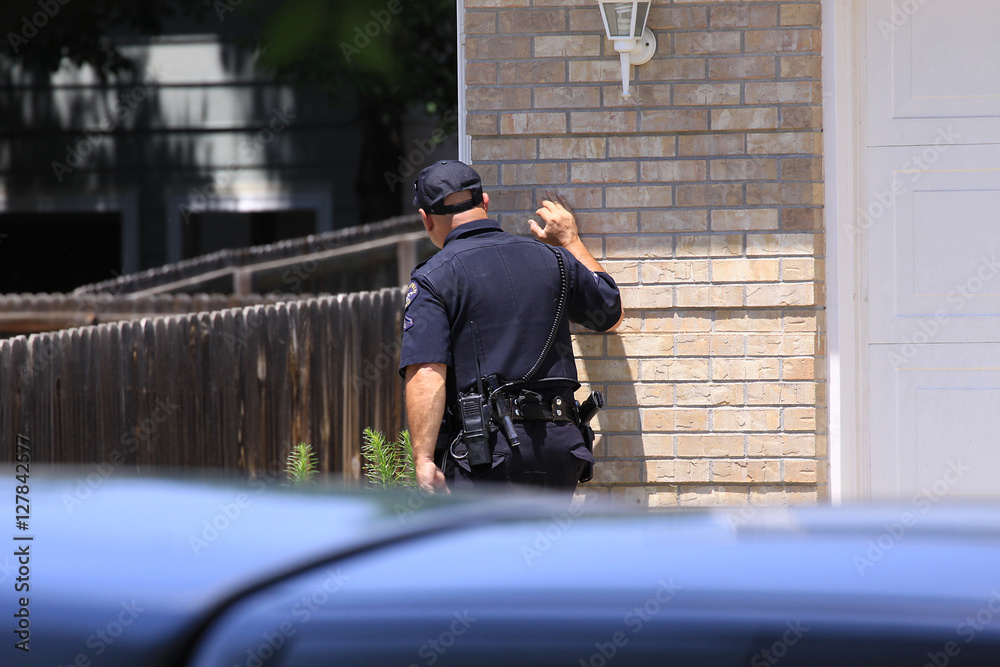 policeman searching for suspect policeman searching for suspect
