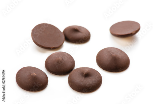 Dark chocolate chips isolated on white background