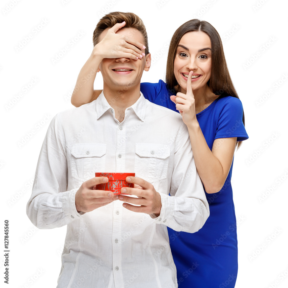 Happy young couple with Valentine's Day present Happy young couple with Valentine's Day present