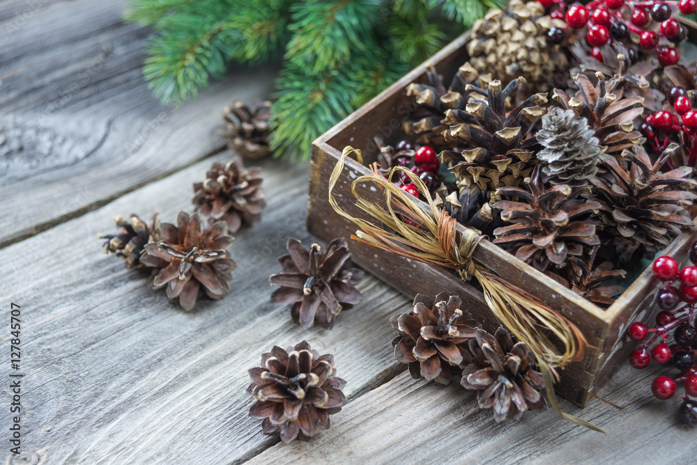 Pine cones in a wooden box Pine cones in a wooden box