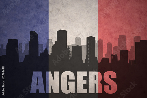 abstract silhouette of the city with text Angers at the vintage french flag