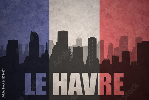 abstract silhouette of the city with text Le Havre at the vintage french flag
