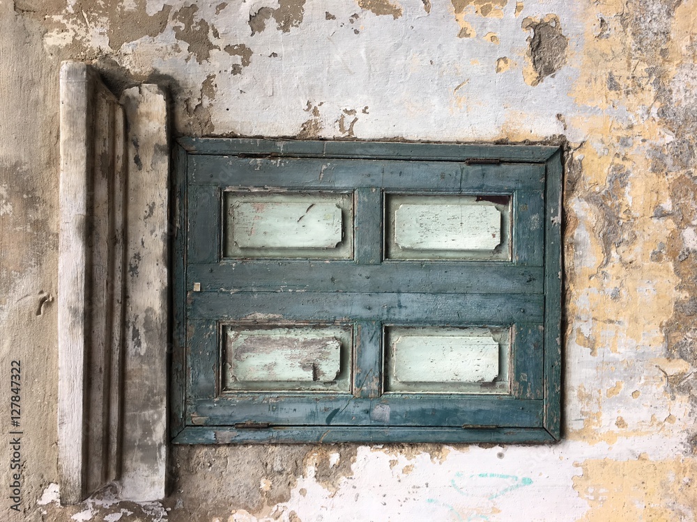 Background ,Textured concrete wall,an old wooden window on walls were Background ,Textured concrete wall,an old wooden window on walls were