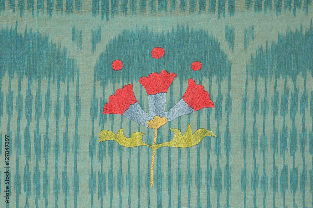 background from the tissue and textile with oriental ornate ornament and pattern in the form of a flower