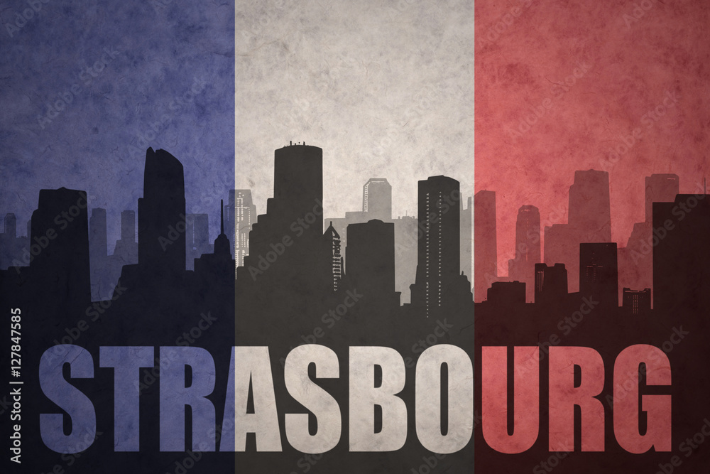 abstract silhouette of the city with text Strasbourg at the vintage french flag