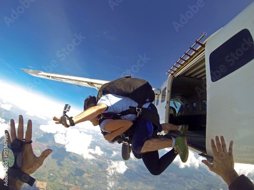 Skydivers jumping from the plane point of view