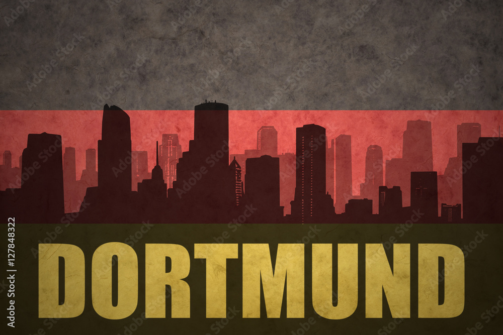 abstract silhouette of the city with text Dortmund at the vintage german flag