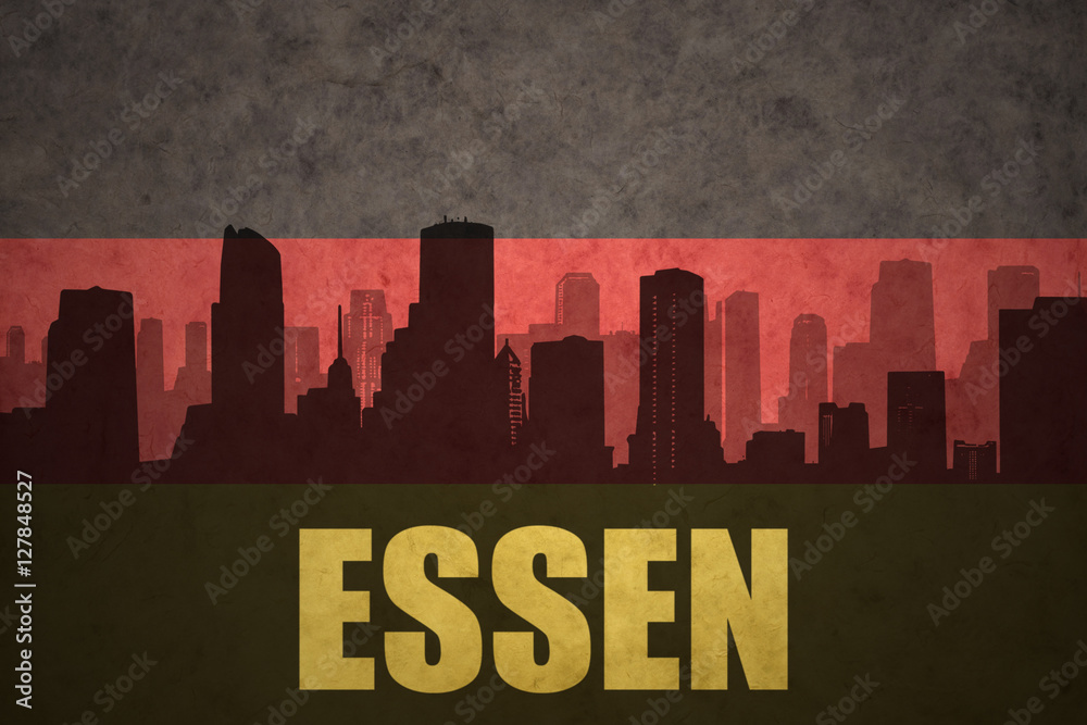 abstract silhouette of the city with text Essen at the vintage german flag