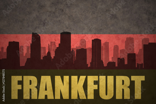 abstract silhouette of the city with text Frankfurt at the vintage german flag