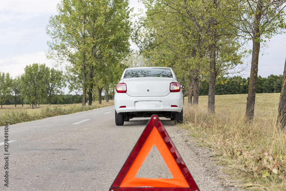 red triangle to warn the other road users about a damaged car
