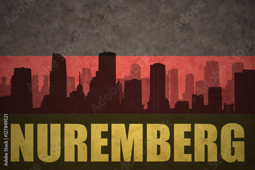 abstract silhouette of the city with text Nuremberg at the vintage german flag