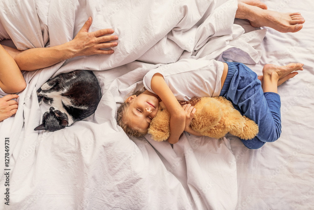 Family relaxing together on bedroom Family relaxing together on bedroom
