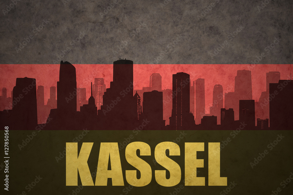 abstract silhouette of the city with text Kassel at the vintage german flag