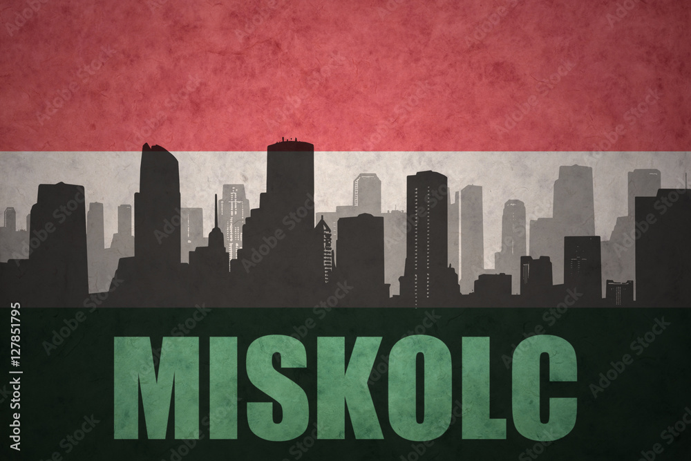 abstract silhouette of the city with text Miskolc at the vintage hungarian flag