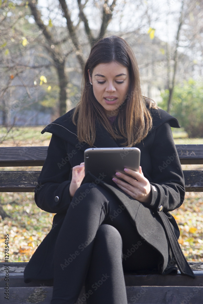 Fototapeta premium Young business woman with a tablet