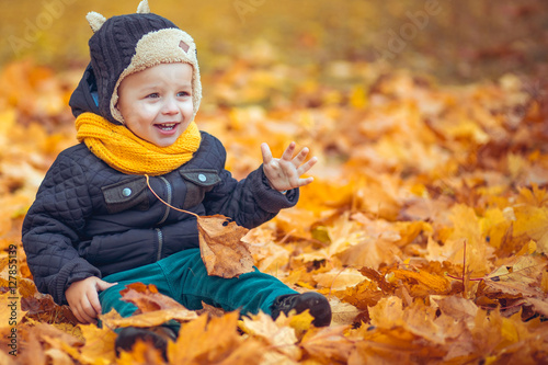little boy in autumn park