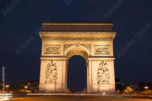 Triumphal arch. Paris. France. View Place Charles de Gaulle. Famous touristic architecture landmark in summer night. Napoleon victory monument. Symbol of french glory. World historical heritage. Toned © sergiymolchenko
