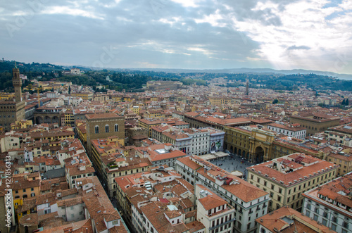 The tuscan red rooftops of Florence with a square in the middle