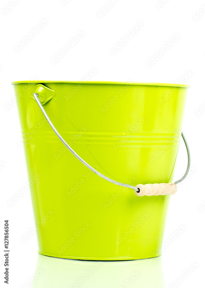 Green iron/metal bucket/pail/container with handle isolated on white background. Colorful kid child toys. Garden equipment. Side view. Green iron/metal bucket/pail/container with handle isolated on white background. Colorful kid child toys. Garden equipment. Side view.