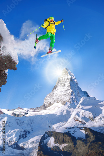 Skier jumping against Matterhorn peak in Switzerland.